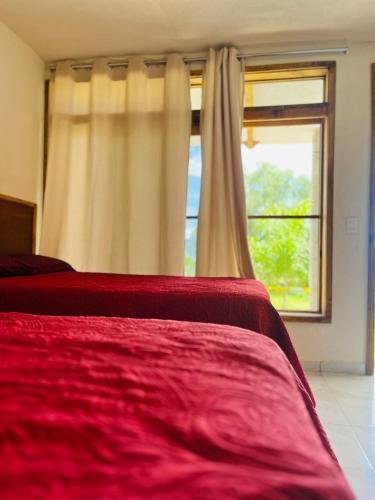 Una cama o camas en una habitación de Cabaña Donatos