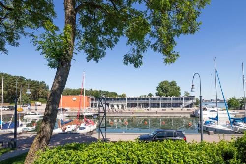 a marina with boats in the water at Smiltynės Jachtklubas in Klaipėda