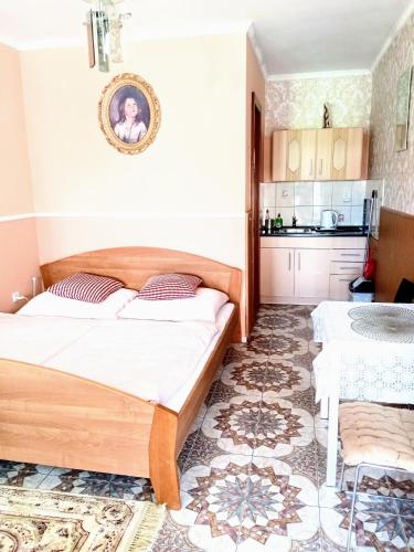 A bed or beds in a room at Apartmany a Chata Agy