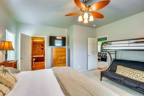 a bedroom with a bed and a ceiling fan at half Mi to Lake Texoma Home with Fire Pit and Grill! in Kingston
