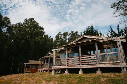 a house on top of a hill with trees at Costanoa in Pescadero