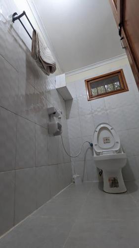 Ванная комната в JACARANDA HOMESTAY