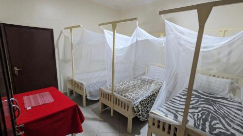 Кровать или кровати в номере JACARANDA HOMESTAY