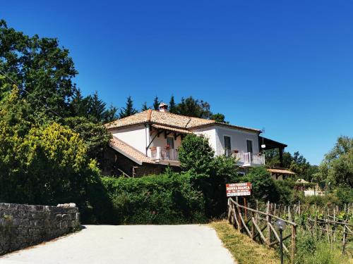 a house with a sign in front of it at Agriturismo Donna Bianca in Mormanno