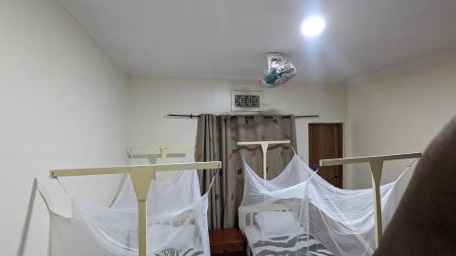 Кровать или кровати в номере JACARANDA HOMESTAY