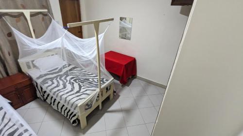 Кровать или кровати в номере JACARANDA HOMESTAY