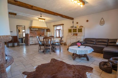 a living room with a couch and a table at Siedlisko Bogdanka in Leszczewek