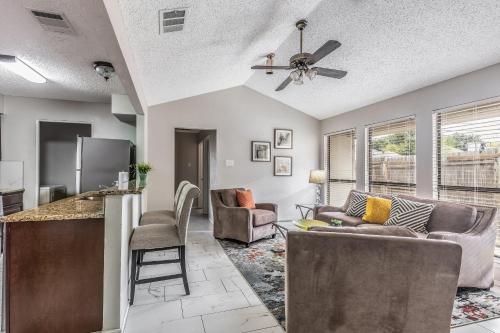 a kitchen and living room with a ceiling fan at Frisco Elegance Retreat in Frisco