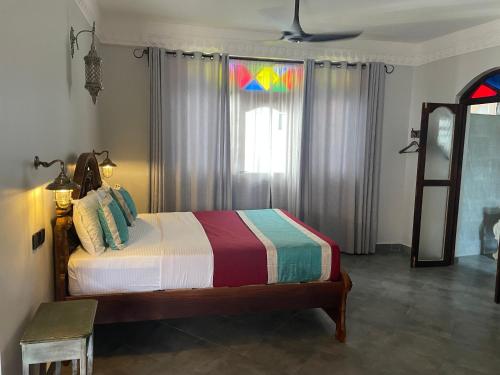 Letto o letti in una camera di Mizingani Seafront Hotel