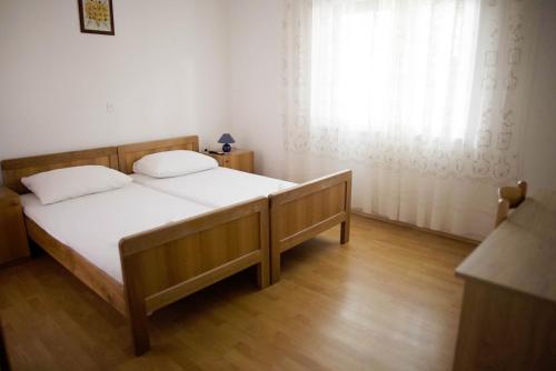 Postel nebo postele na pokoji v ubytování Seaside Apartments
