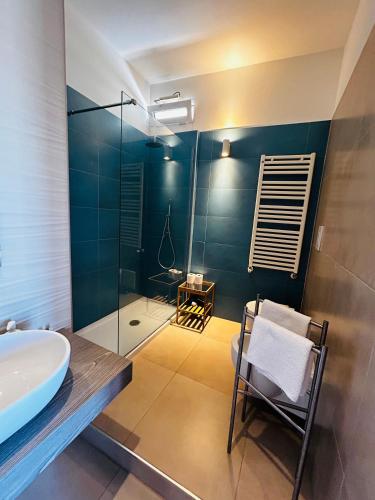 a bathroom with a sink and a glass shower at Apartment Antonella in Ostuni