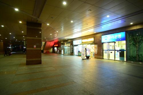 an empty hallway of a shopping mall at night at Residence Unicorn in Seoul