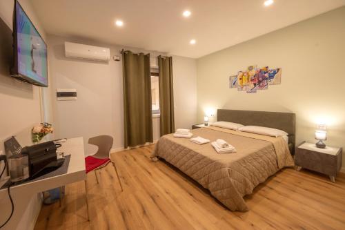 Postel nebo postele na pokoji v ubytování LA META ROOMS