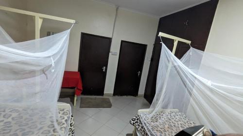 Кровать или кровати в номере JACARANDA HOMESTAY