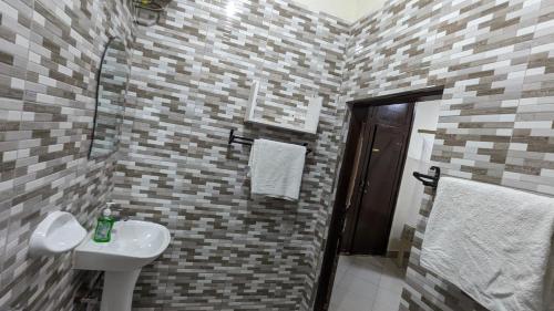 Ванная комната в JACARANDA HOMESTAY