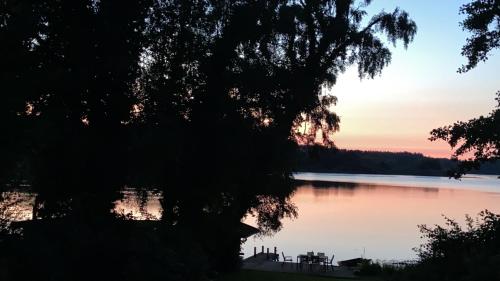 a view of a lake at sunset at Seeblick in Westensee