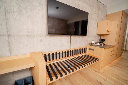a kitchen with a wooden bench in a room at GO Quito Hotel in Quito