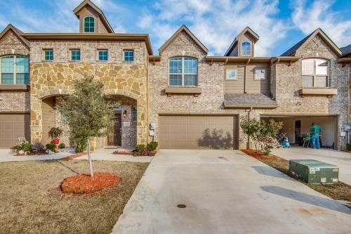 a large brick house with a garage at Irving Bliss in Irving