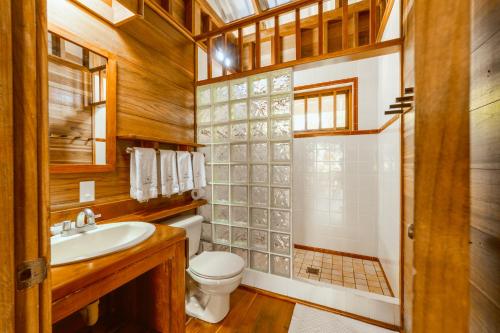 a bathroom with a toilet and a sink at Casa Viva Eco Lodge in Puerto Viejo
