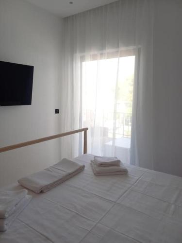 Postel nebo postele na pokoji v ubytování Kepesis Apartment