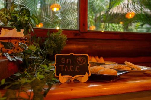 a sign that says sun taco on a table with food at Cabañas DELUXE DUNAS DEL ESTE in Punta Colorada