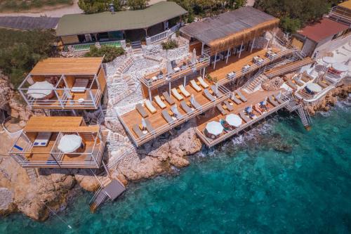 an aerial view of a resort on the water at Likya Gardens Hotel in Kas