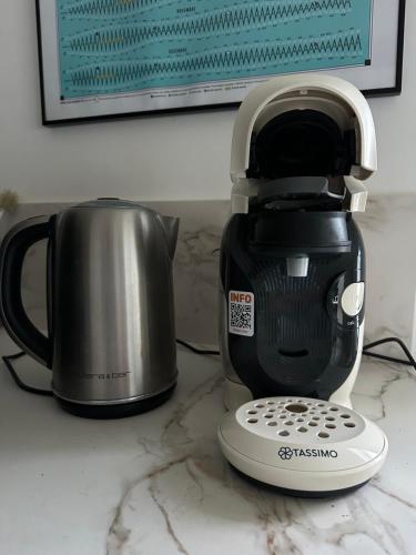 a toaster and a coffee pot on a counter at Studio rénové à neuf in La Tranche-sur-Mer