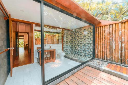 an external view of a bathroom with a toilet at Casa Viva Eco Lodge in Puerto Viejo