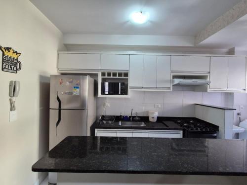 Køkken eller tekøkken på Apartamento E-23 Edifício Villa Monreale - Praia Itaguá