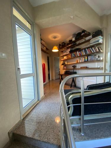 a room with a bed and a book shelf at Private villa suitable for families with stunning sea views in Buyukcekmece