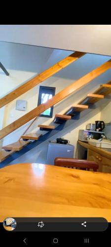 a room with a wooden table with two chairs at Cozy corner in Ongata Rongai 
