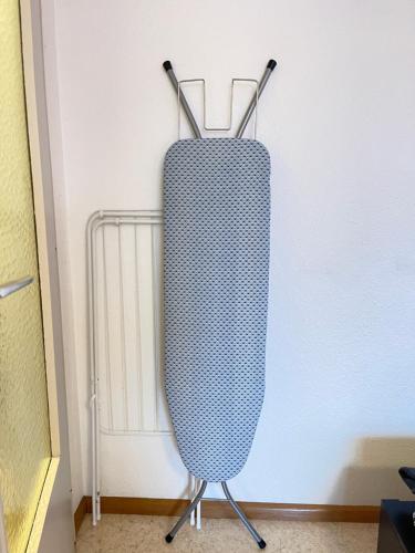 a punching bag is standing in front of a wall at Fanta flat France Suisse in Saint-Louis