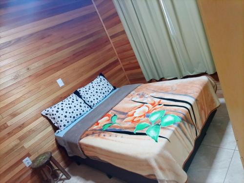 En eller flere senge i et værelse på Casa Vó Rose