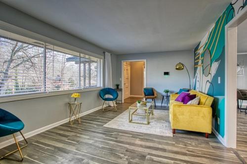 a living room with a yellow couch and chairs at Rocksteady Atlanta Decatur in Decatur