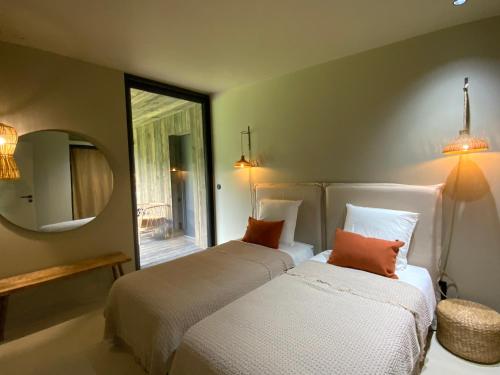 En eller flere senge i et værelse på Lisière du Lac - 100m du Lac