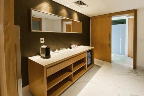 a bathroom with a sink and a mirror at Hotel Nacional Rio de Janeiro - OFICIAL in Rio de Janeiro