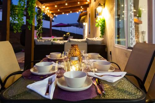 a table set for a meal on an outdoor patio at Amethyst Hearth - Family Spa Serenity, Zoo, Beach, Disneyland, Legoland in Vista