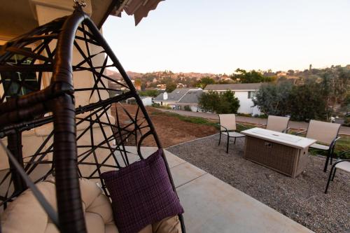 a view of a patio with a table and chairs at Amethyst Hearth - Family Spa Serenity, Zoo, Beach, Disneyland, Legoland in Vista