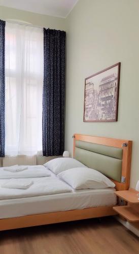 Postel nebo postele na pokoji v ubytování Pension I