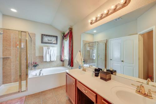 a bathroom with a tub and a sink and a shower at San Antonio Home - Outdoor Oasis and Greenbelt Views in San Antonio