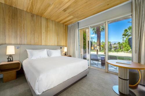 a bedroom with a bed and a large window at Grand Hyatt Indian Wells Resort & Villas in Indian Wells