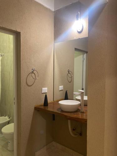 a bathroom with a sink and a mirror at Casa finca La catalina I in Maco