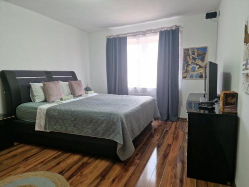 Postel nebo postele na pokoji v ubytování Apartman Galerija