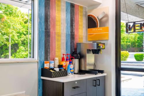 a kitchen with a counter with a coffee maker at Motel 6-Charlotte, NC - Coliseum in Charlotte