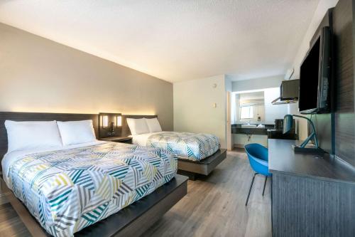 Ένα ή περισσότερα κρεβάτια σε δωμάτιο στο Motel 6-Charlotte, NC - Coliseum