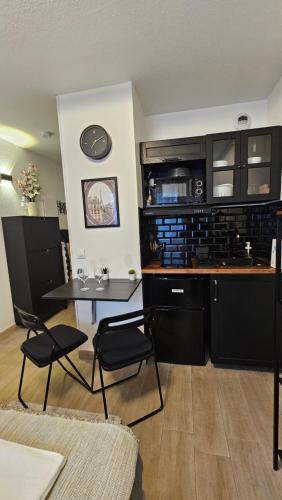 Η κουζίνα ή μικρή κουζίνα στο Logement Arche de la Défense, Arena spectacle, wifi, parking gratuit