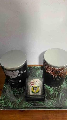 two coffee cups sitting on a tray on a table at Apartamento en alquiler en la guaira con piscina in La Guaira