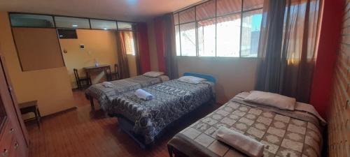 Postel nebo postele na pokoji v ubytování Qinti Hospedaje Huancayo