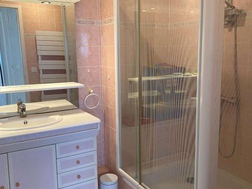 a bathroom with a glass shower and a sink at Superbe T3 avec loggias fermées, garage, et wifi à Balaruc-les-Bains, classé 3 étoiles - FR-1-553-216 in Balaruc-les-Bains