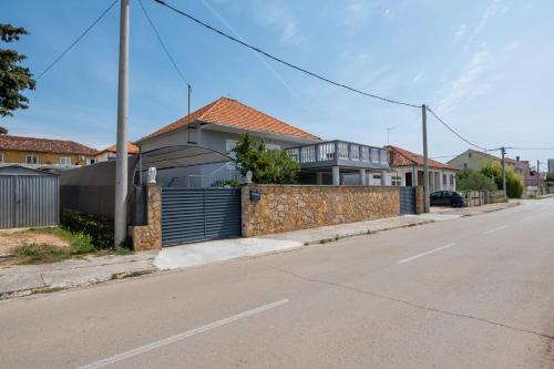 Family friendly apartments with a swimming pool Zadar - 22530